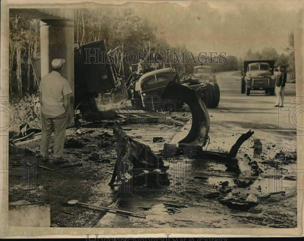 1961 Press Photo Bystanders survey debris from truck accident in New York