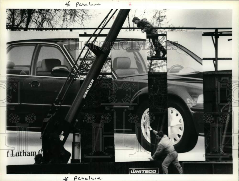 1991 Press Photo Crew assembles billboard on Central Avenue in Colonie, New York- Historic Images