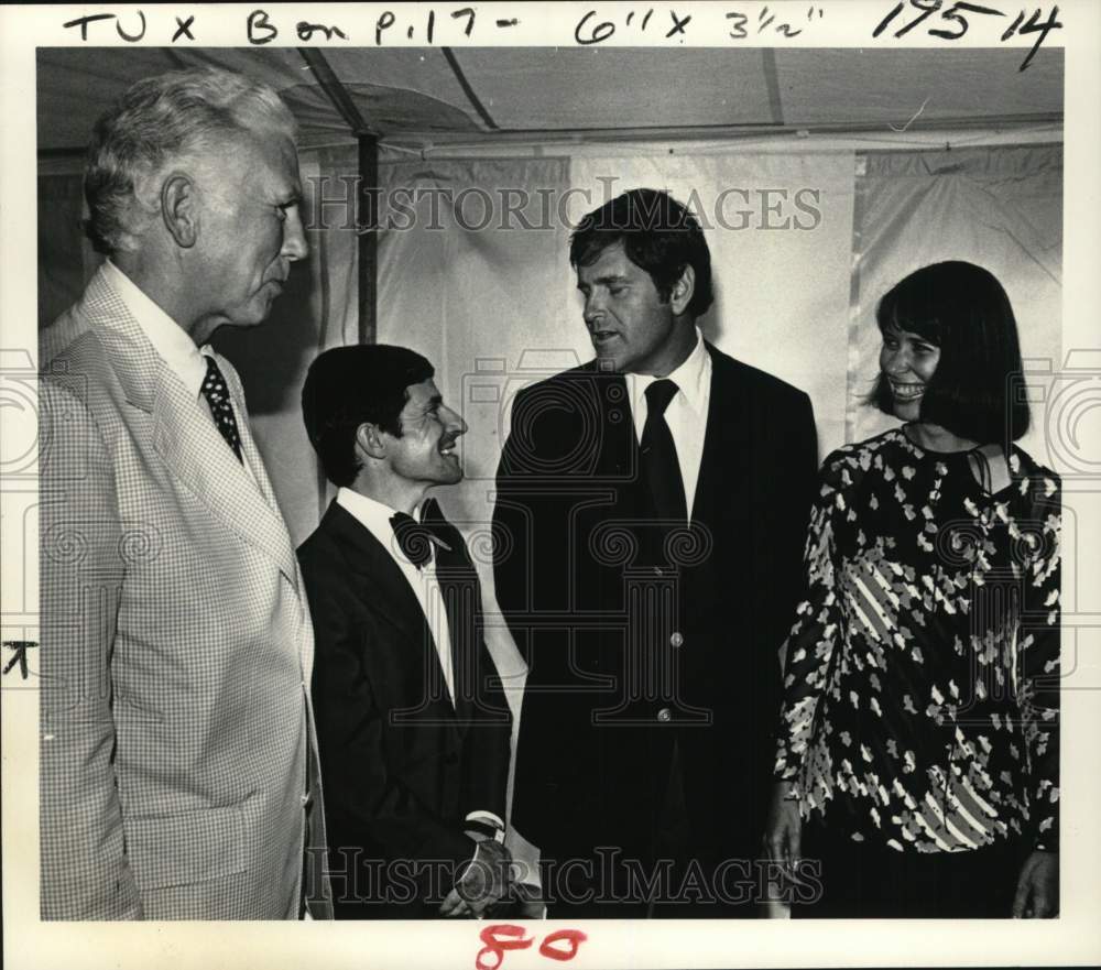 1977 Press Photo Group chats with horse jockey in tent at New York event- Historic Images