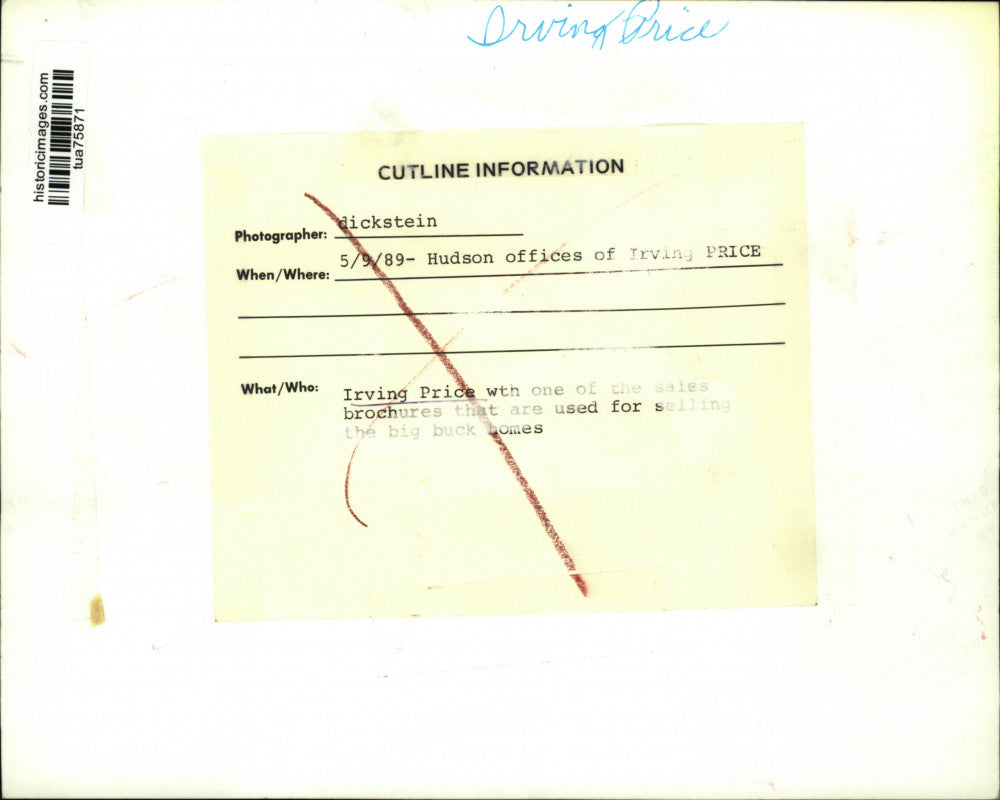 1989 Press Photo Irving Price with home sales brochure at office in New York