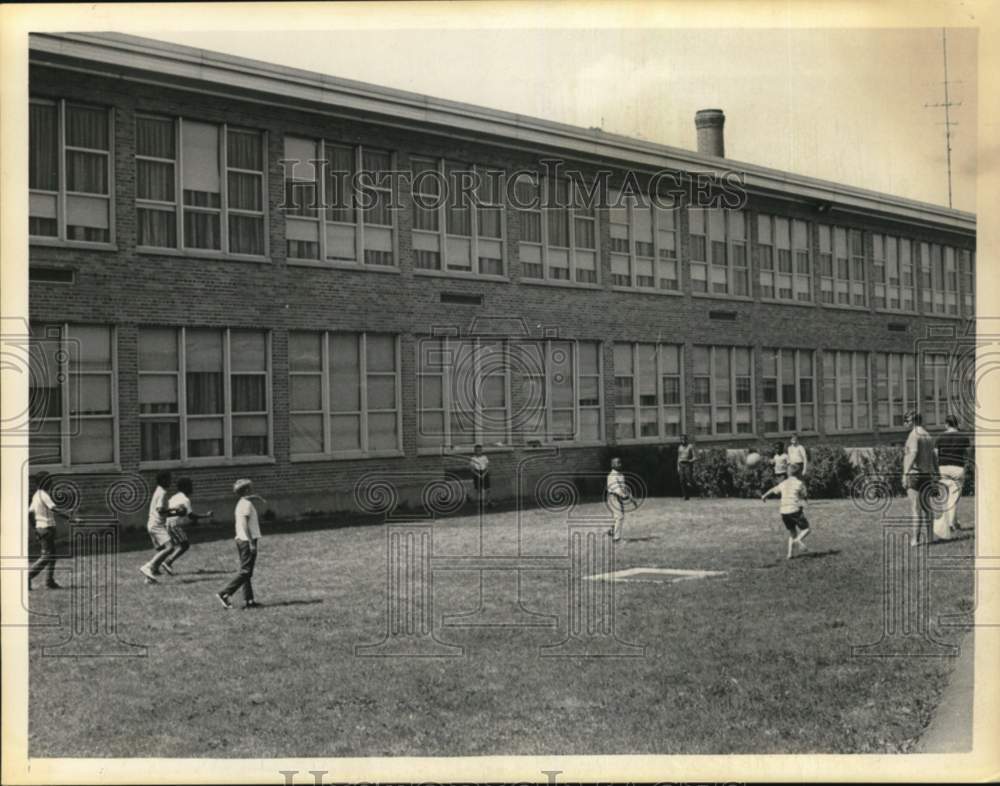 1968 Press Photo Adults watch over kids on playground in New York - tua78925- Historic Images