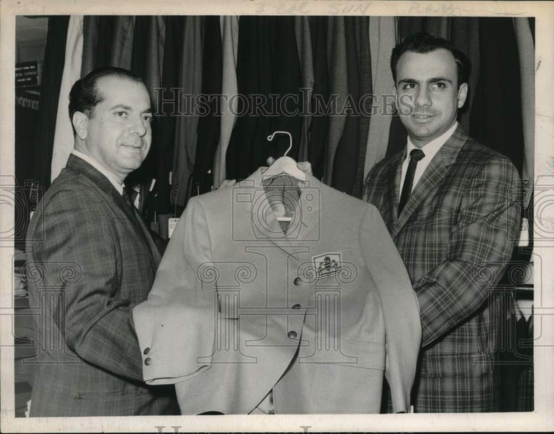 Load image into Gallery viewer, 1963 Press Photo Menswear store owners hold up blazer in Albany, New York
