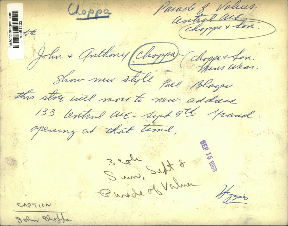 1963 Press Photo Menswear store owners hold up blazer in Albany, New York