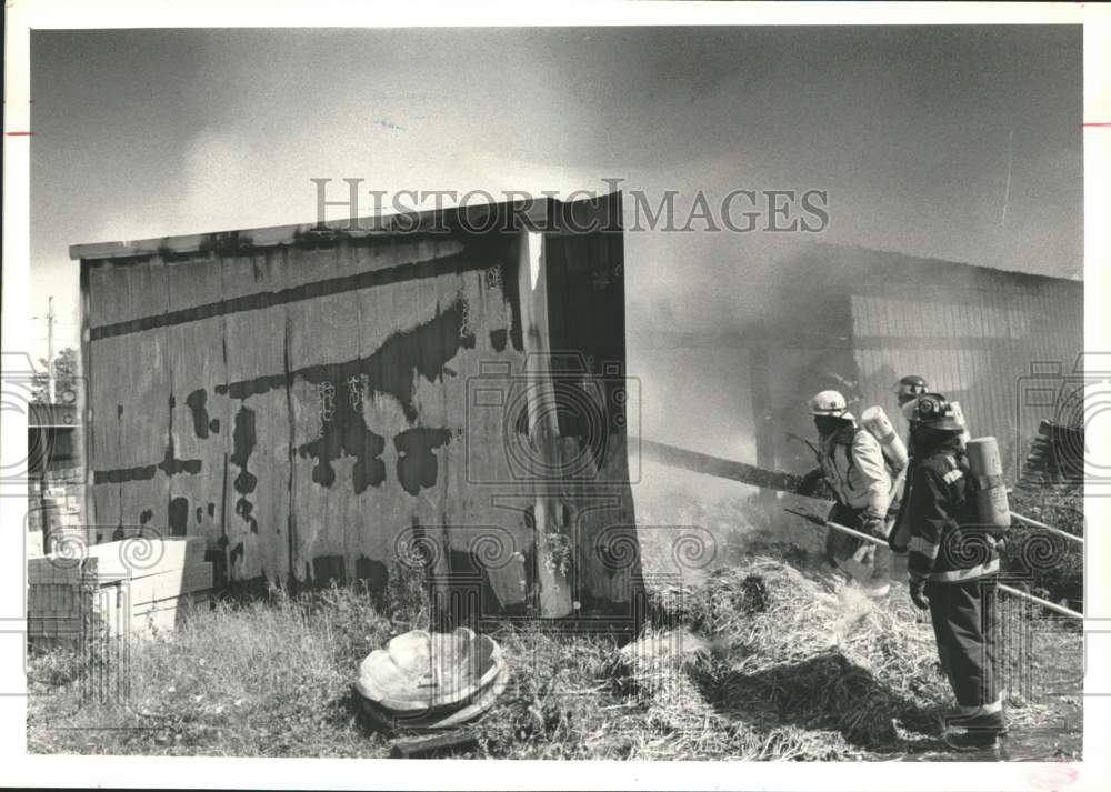 1990 Press Photo Firemen at scene of shed fire in Clifton Park, New York- Historic Images