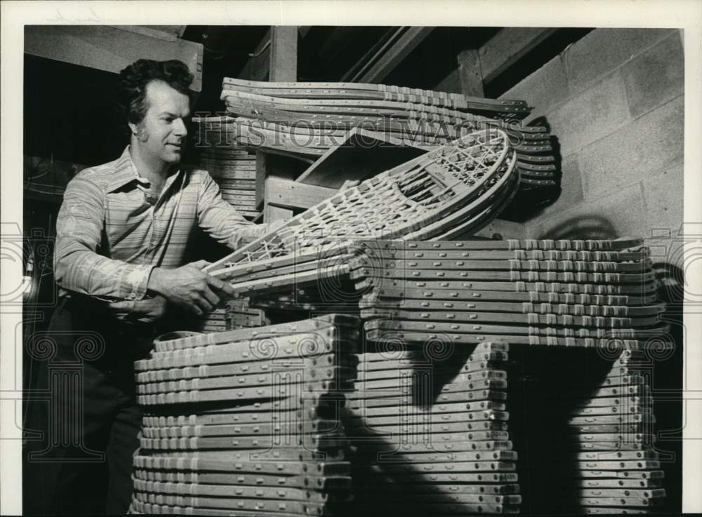 1980 Press Photo Richard Harbick with stack of snowshoes in New York - tub11495- Historic Images