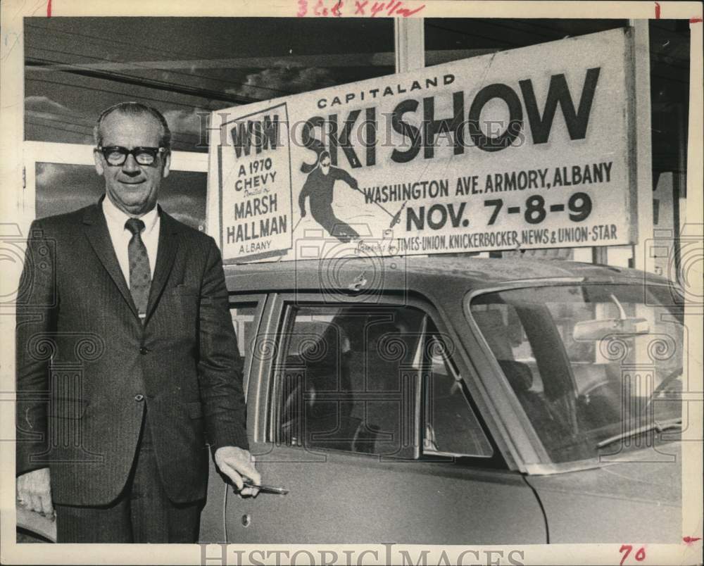 1969 Press Photo Marshall Hallman poses with contest prize car in New York