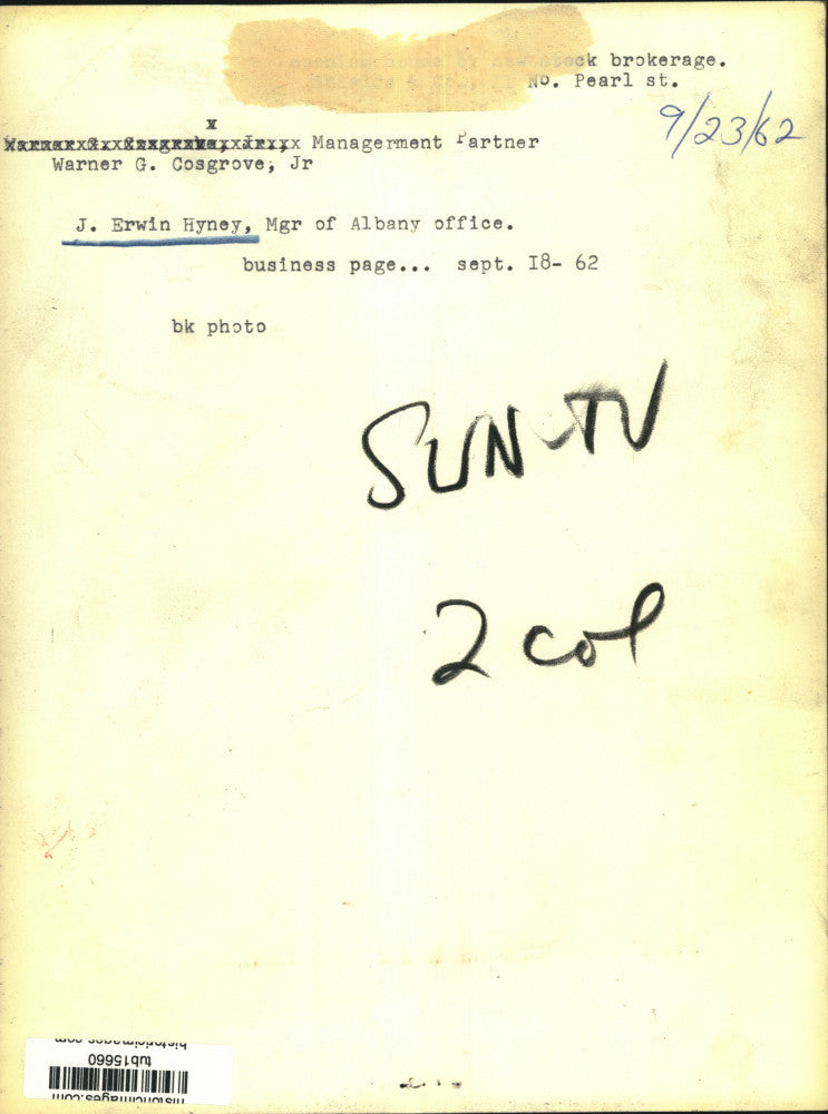 1962 Press Photo Brokers Warner Cosgrove Jr and J Erwin Hyney examine stock tape