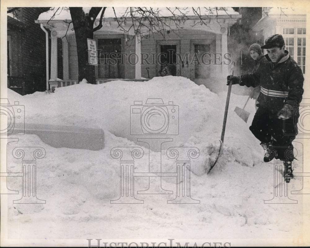 1969 Press Photo Young Men Shovel Snow on North Allen Street - tub18067