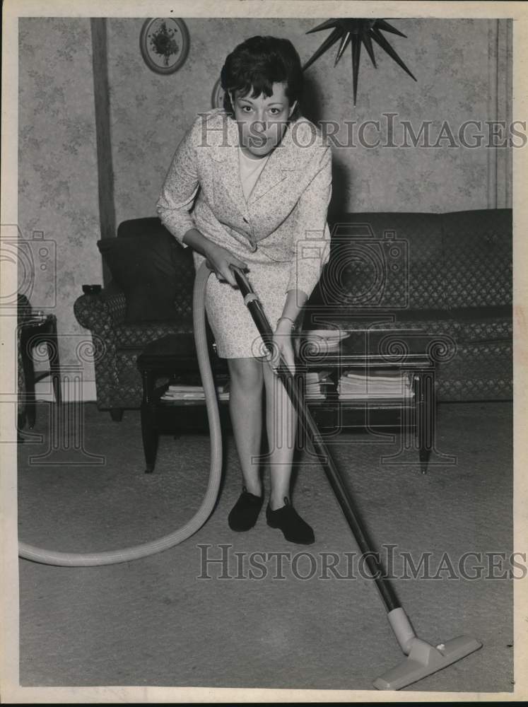 Press Photo Woman Vacuums Living Room - tub18425- Historic Images