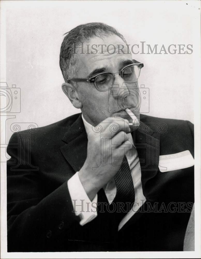 Load image into Gallery viewer, 1964 Press Photo Theodore Tannenwald, Jr. Smokes Cigarette - tub20411
