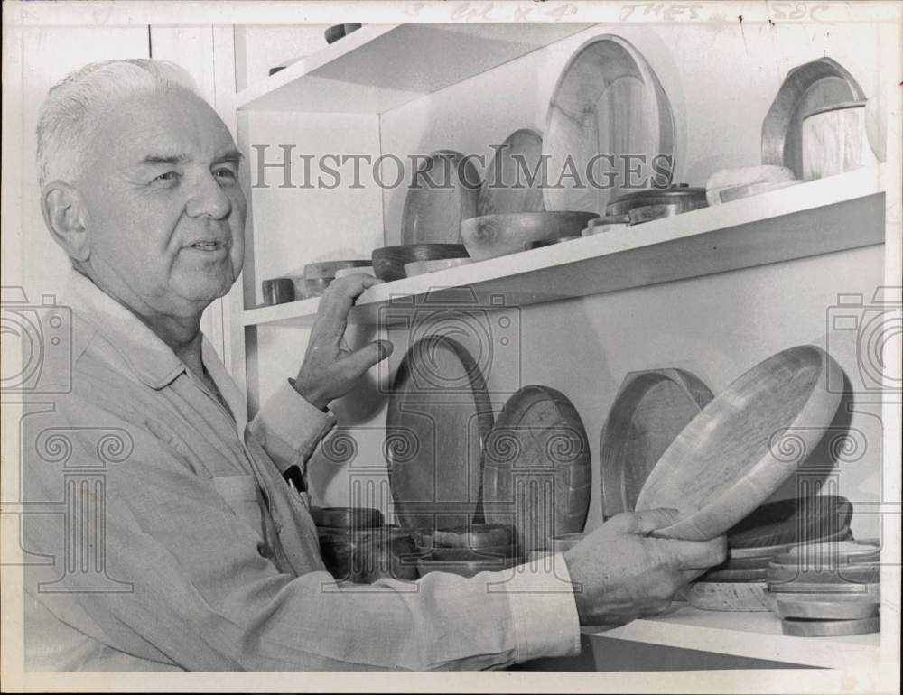 1966 Press Photo Dr. C.M. Suter Shows Display of Finished Wood Plates and Bowls