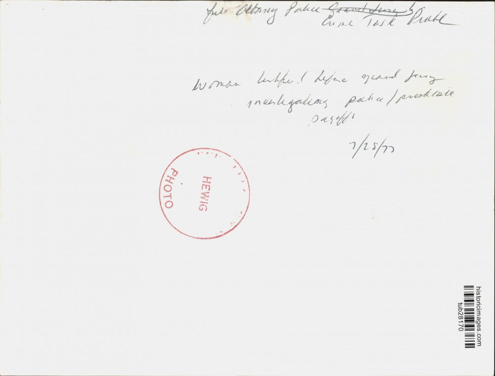 1977 Press Photo Woman Reading Newspaper Before Grand Jury Investigating Payoffs