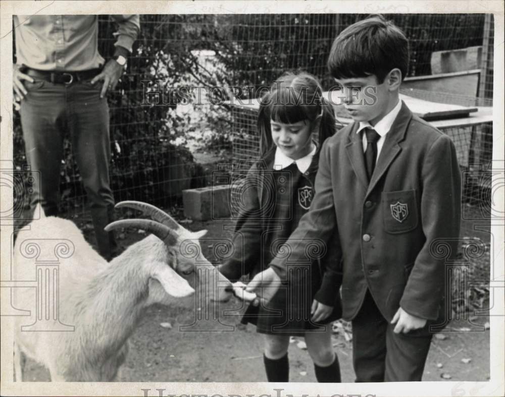 Press Photo Paul J. Tazbir, Jr. and Friend Feeding Goat - tub35248- Historic Images