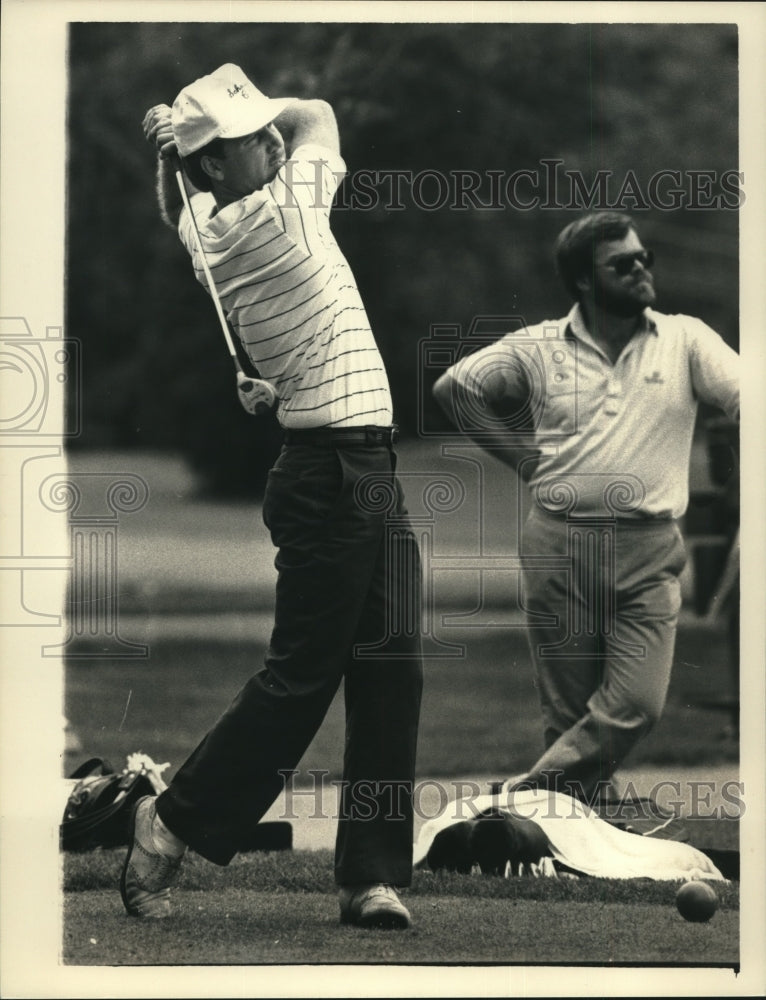 Press Photo Golfer Robby Bigley tees off on golf course as another man watches- Historic Images