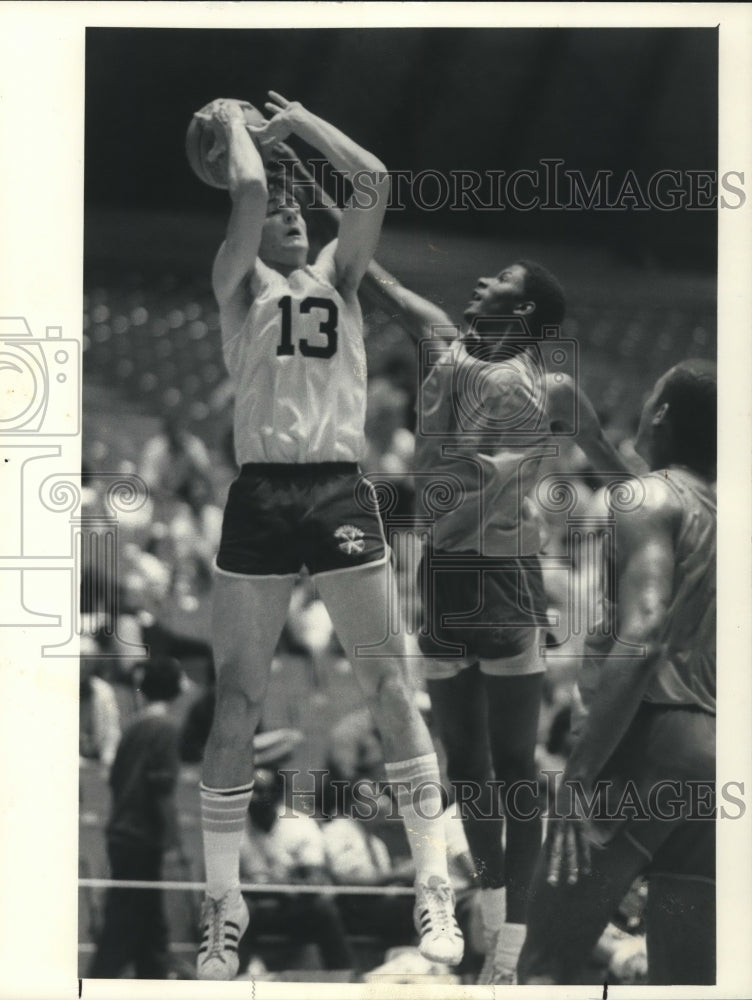 Press Photo Basketball player Tim Cain has shot blocked during game in New York- Historic Images