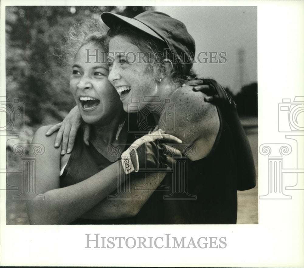 Press Photo Two ladies smile and hug each other during Empire State Games, NY- Historic Images