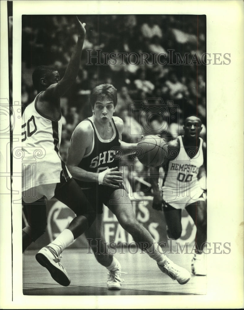 Press Photo Greg Koubek drives to the basket against a defender in game- Historic Images