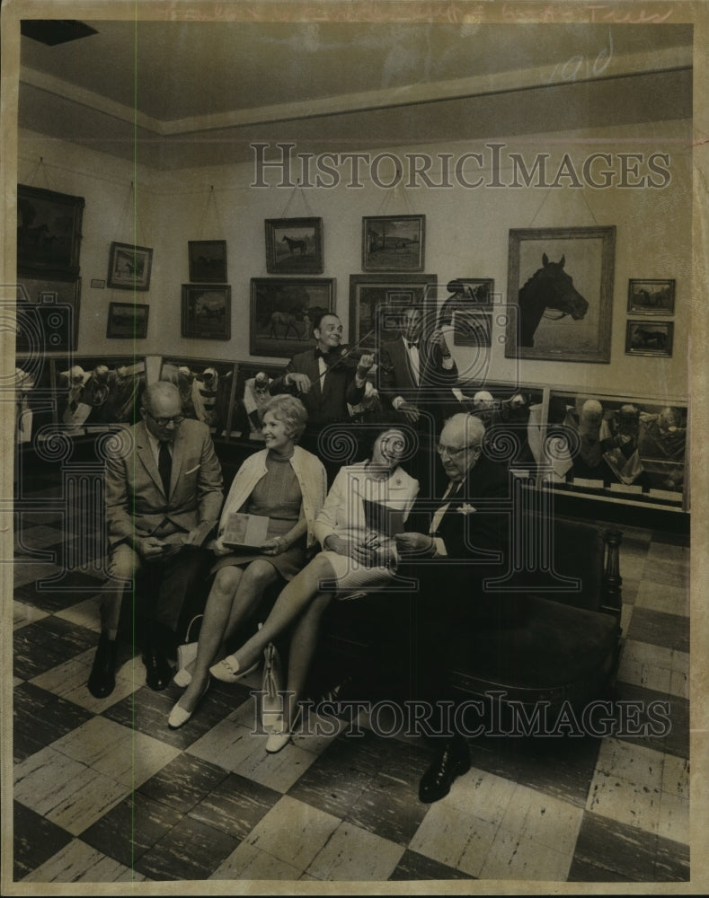 1969 Press Photo Guests look at program at National Museum of Racing, Saratoga- Historic Images