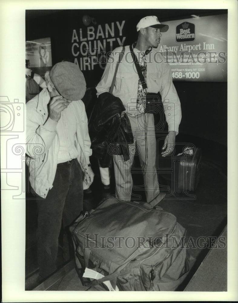 Press Photo Villanova boys basketball players get their bags at Albany airport- Historic Images