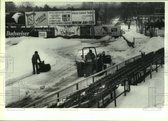 Press Photo Crew removes snow from infield at Heritage Park, Colonie, New York- Historic Images