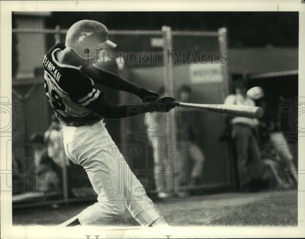 Press Photo East Greenbush player #29 Lateep Duncan swings at pitch during game- Historic Images