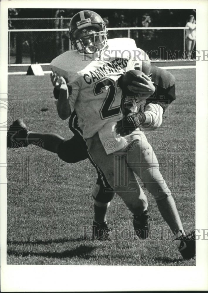 Press Photo Watervliet football player #22 gets tackled from behind by AA player- Historic Images