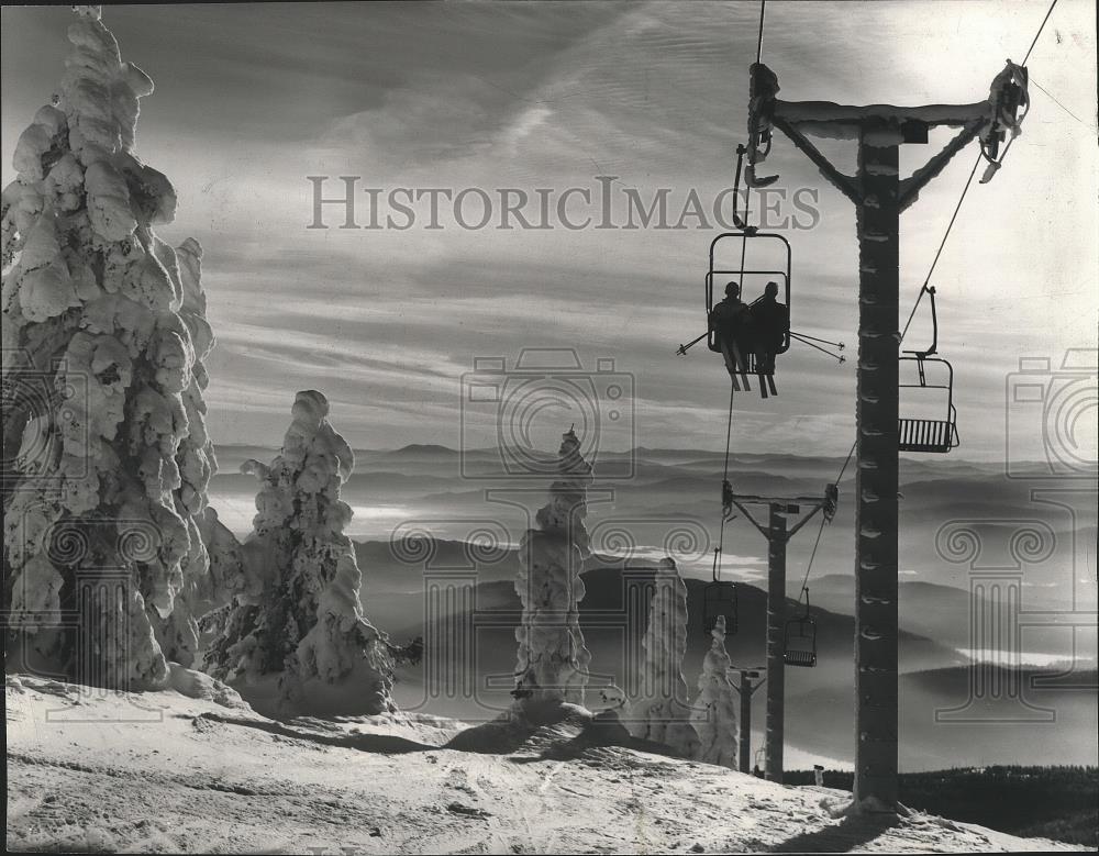 1963 Press Photo Skiers ride lift at Big Mountain ski area in Montana - sps07442 - Historic Images