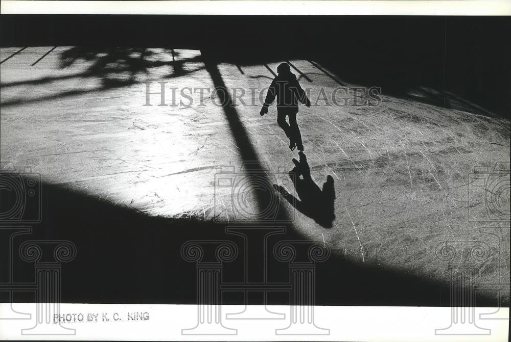 1990 Press Photo Conrad Wold, 7, has downtown Spokane skating rink to himself - Historic Images