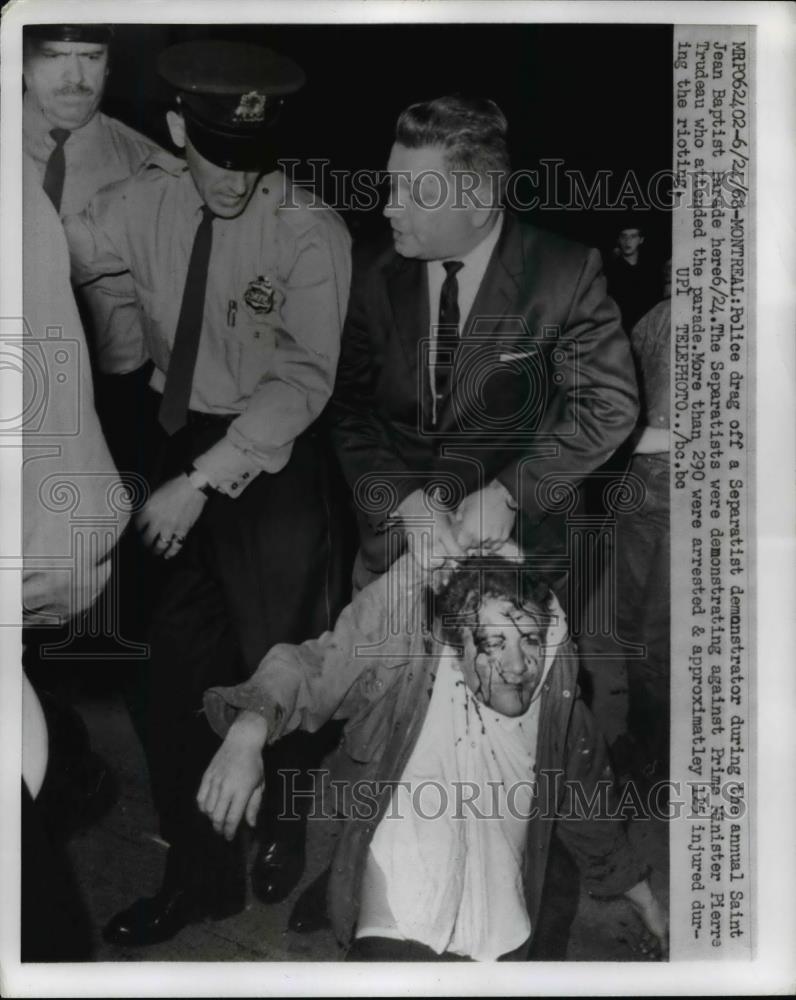 1968 Press Photo Police Drag Off Separatist Demonstrator at St Jean Baptist Fest - Historic Images