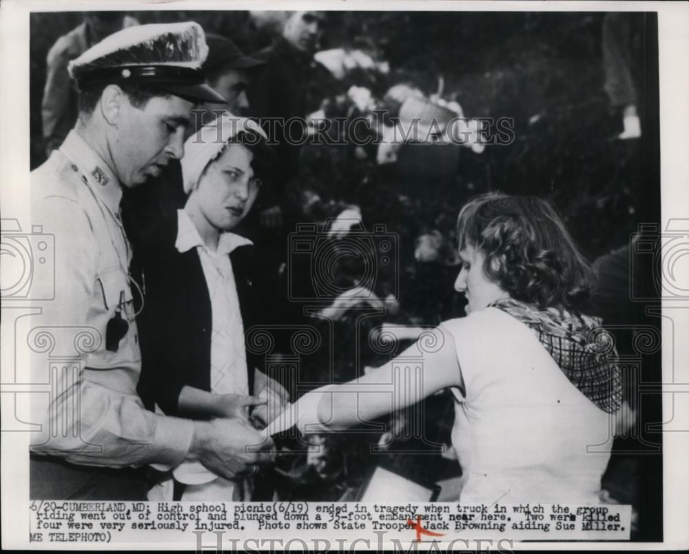 1950 Press Photo Jack Browning Aiding Sue Miller Following Truck Disaster - Historic Images