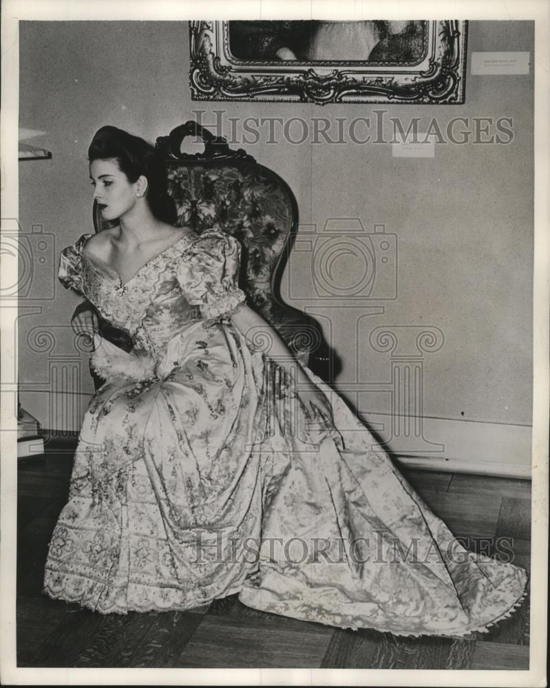 Press Photo Woman holding Fan wearing Dress in Chair - mjb15929 - Historic Images