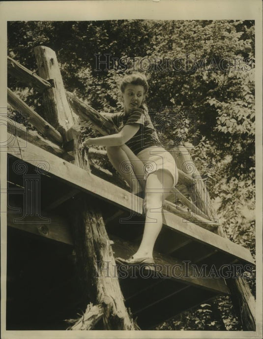 1944 Press Photo Girl Takes "Short Cut" While Climbing - nef69336 - Historic Images