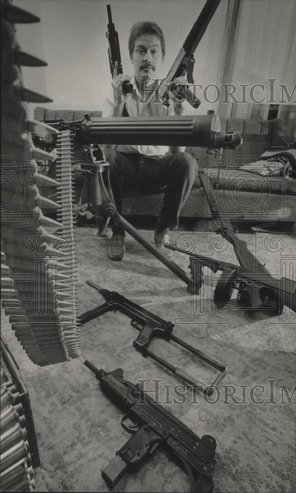 1985 Press Photo Neil Trickel holds an Uzi and an Ingram 10 gun - mjb49878 - Historic Images