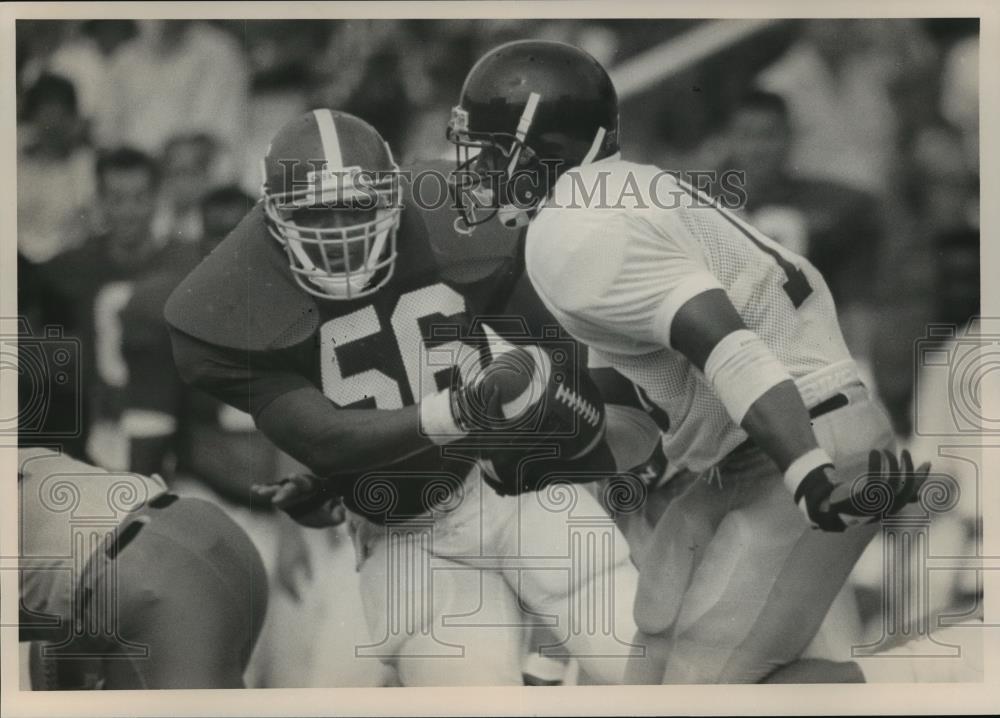 Press Photo Alabama&#39;s Oden Chases Southern Mississippi&#39;s Football Carrier Smith - Historic Images