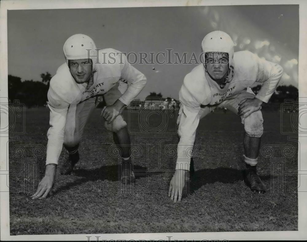 1951 Press Photo Joe Romain and Chuck Kennedy with Shaw High football in Ohio. - Historic Images