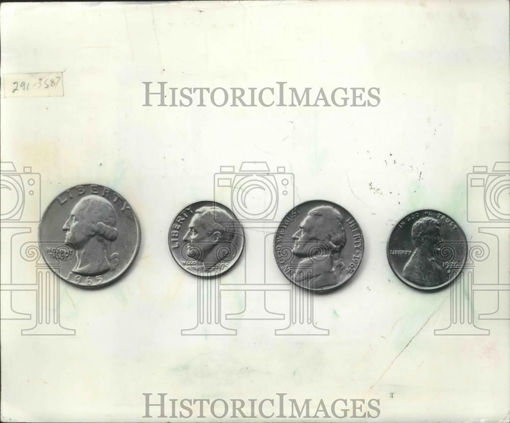 1977 Press Photo Photo of the quarter, dime, nickle and penny coins - mjb53261 - Historic Images