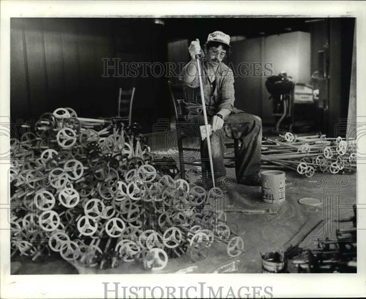 Press Photo Worker paints ski rod - cvb47571 - Historic Images