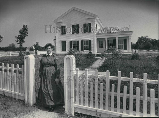 1984 Press Photo Woman standing in front of home at Old World, Wisconsin. - Historic Images