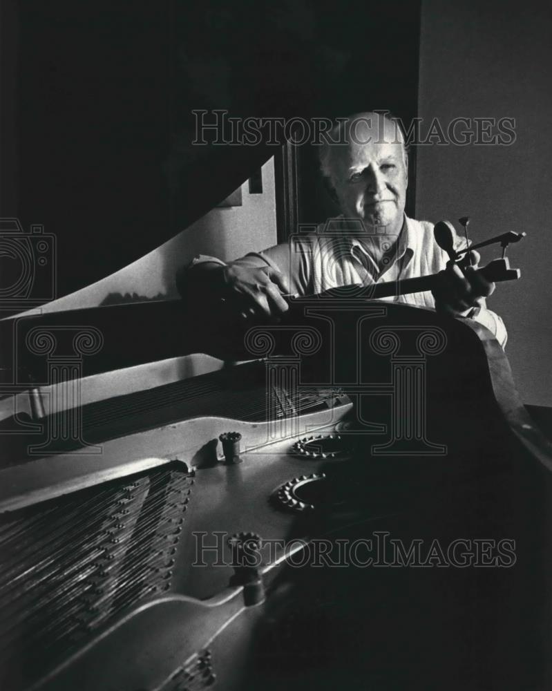 1988 Press Photo Father Robert Novotny restores pianos Holy Rosary Church - Historic Images