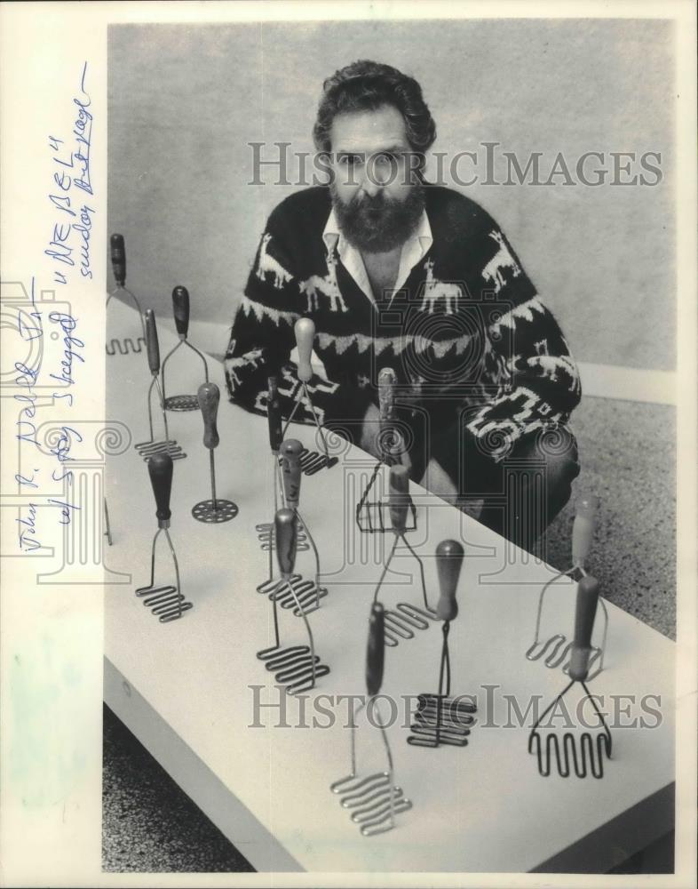 1984 Press Photo Wisconsin artist John Nebel Jr. with some of his potato mashers - Historic Images