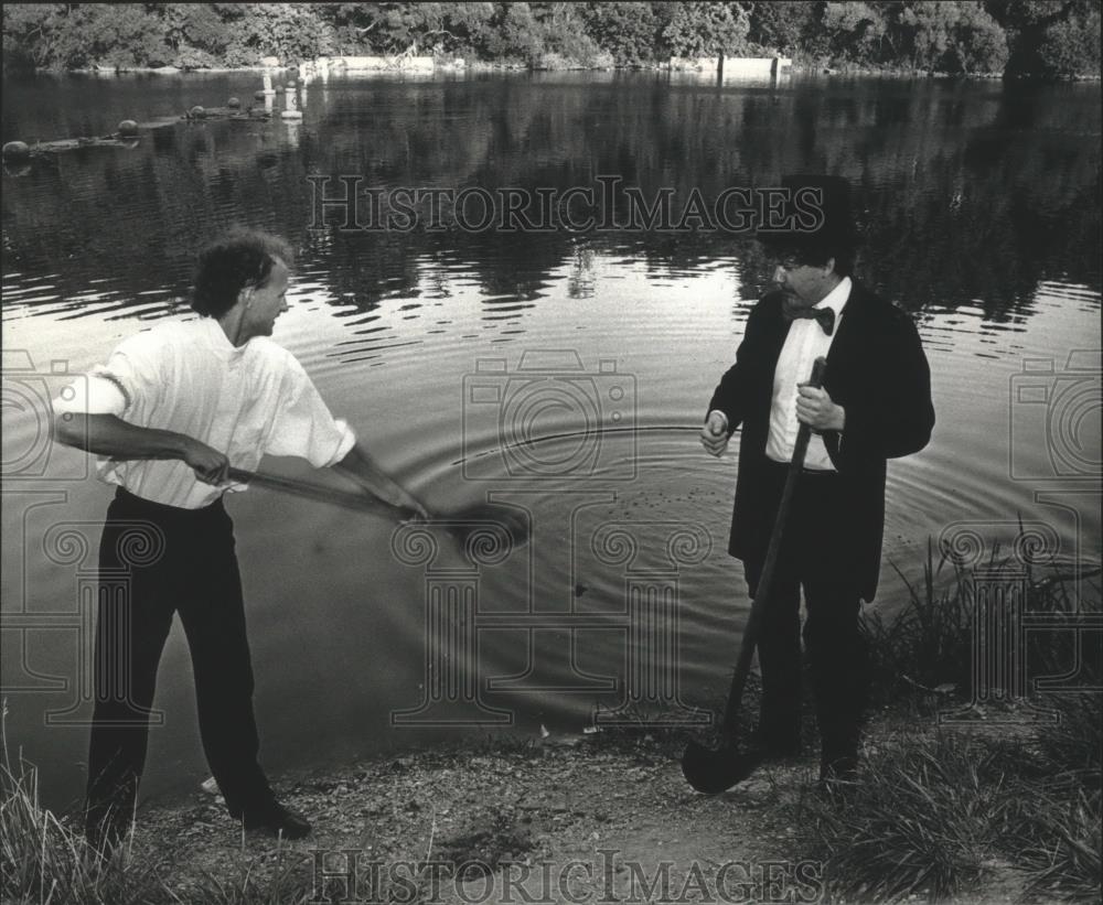 1983 Press Photo Two men reenact digging a canal from Milwaukee River history - Historic Images