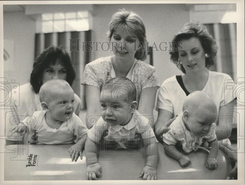 Press Photo women playing with babies. - abna11558 - Historic Images