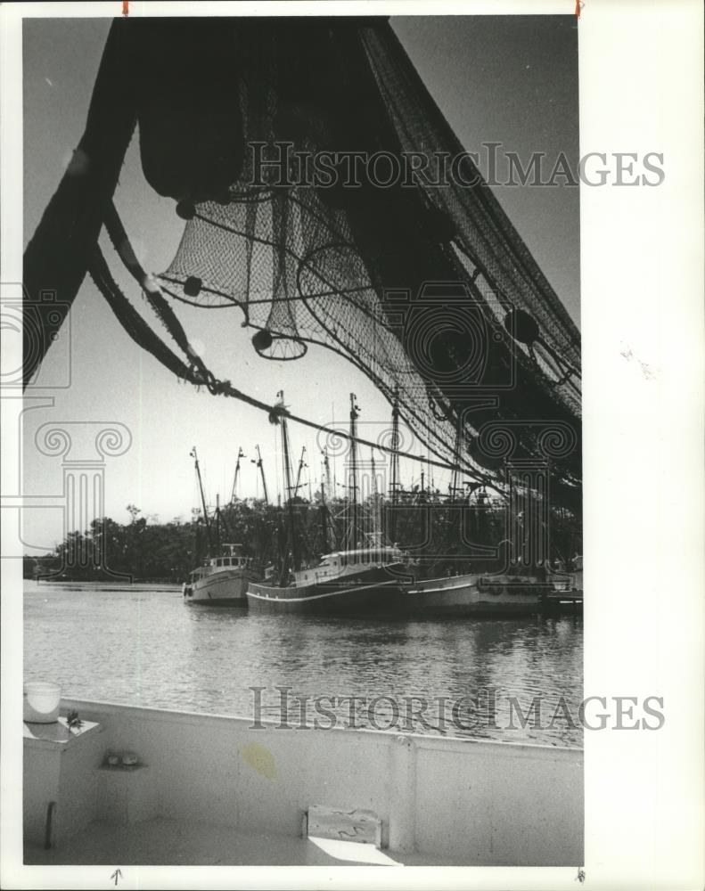 1981 Press Photo View of shrimp boats framed by nets of another boat - abna12552 - Historic Images