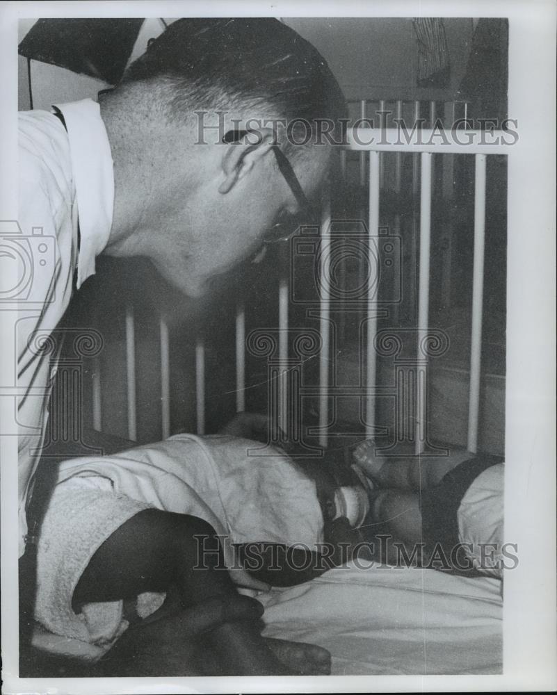 Press Photo Dr. Roy Selby with babies in Malaysia - abna14158 - Historic Images