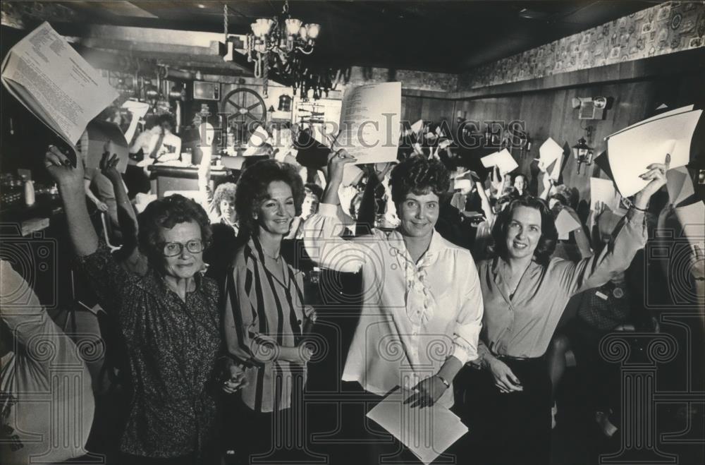 1983 Press Photo Waitress hold IRS paperwork inside restaurant - abna14522 - Historic Images