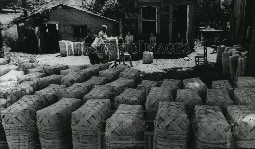 1978 Press Photo Stacks of finished baskets pile up outside basket factory - Historic Images
