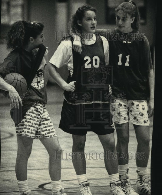1991 Press Photo Pius XI High School Lady Popes players take a break in the gym. - Historic Images