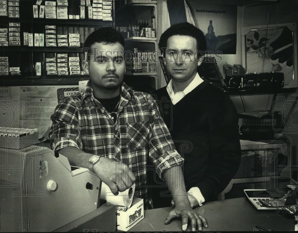 1988 Press Photo Eddy Rodriguez (r) and son, Eddy, in store at in Milwaukee. - Historic Images