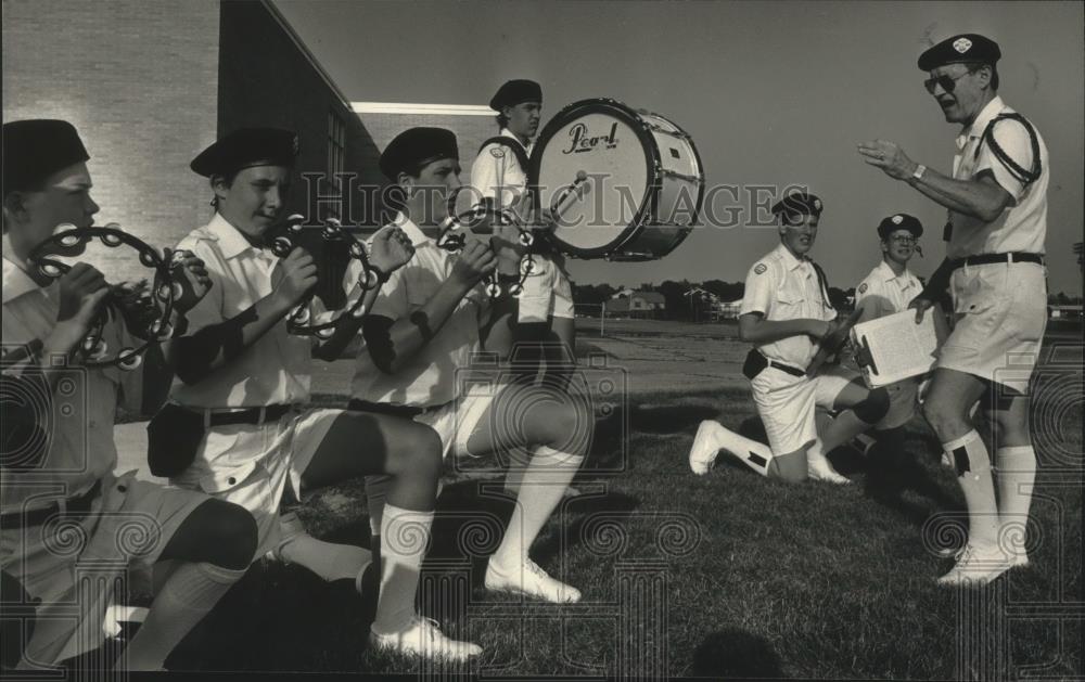 1991 Press Photo Director Jim Sewrey instructs members of the drum brigade - Historic Images