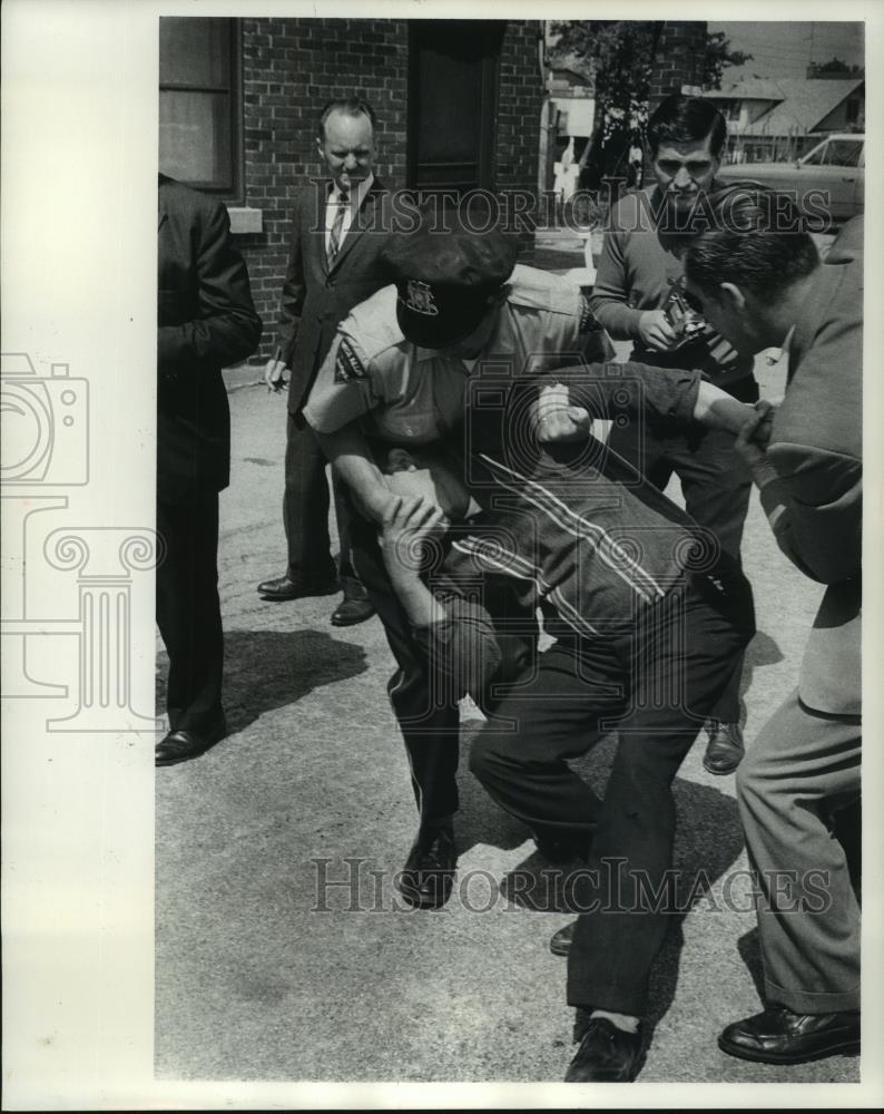 Press Photo Picketer arrested at Pressed Steel Tank Corporation, West Allis - Historic Images